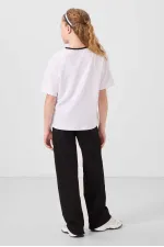 Ensemble de survêtement palazzo Tommylife Wholesale pour filles, col rond, imprimé, jambes larges, coupe standard, blanc et noir, référence 75171