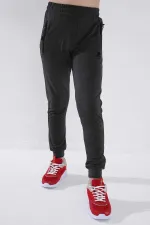 Pantalon de jogging garçon Tommylife en gros, couleur anthracite chiné, avec poches zippées, coupe standard et ourlets resserrés - 64042