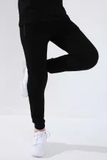 Pantalon de jogging noir pour garçon Tommylife, avec poche zippée, coupe standard et ourlets resserrés - 64042