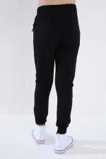 Pantalon de jogging Tommylife bleu marine pour garçon, coupe standard, avec poches zippées et revers - 64042