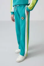 Ensemble de survêtement Tommylife Wholesale pour filles de 7 à 15 ans, col rond, coupe standard, réf. 75165, bleu marine et vert.