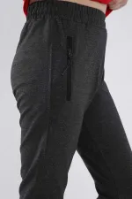 Pantalon de jogging garçon Tommylife en gros, couleur anthracite chiné, avec poches zippées, coupe standard et ourlets resserrés - 64042