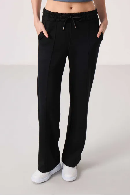 Pantalon palazzo pour femme Tommylife, en tissu doux, avec poches et surpiqûres apparentes - Noir 94670 (vente en gros)