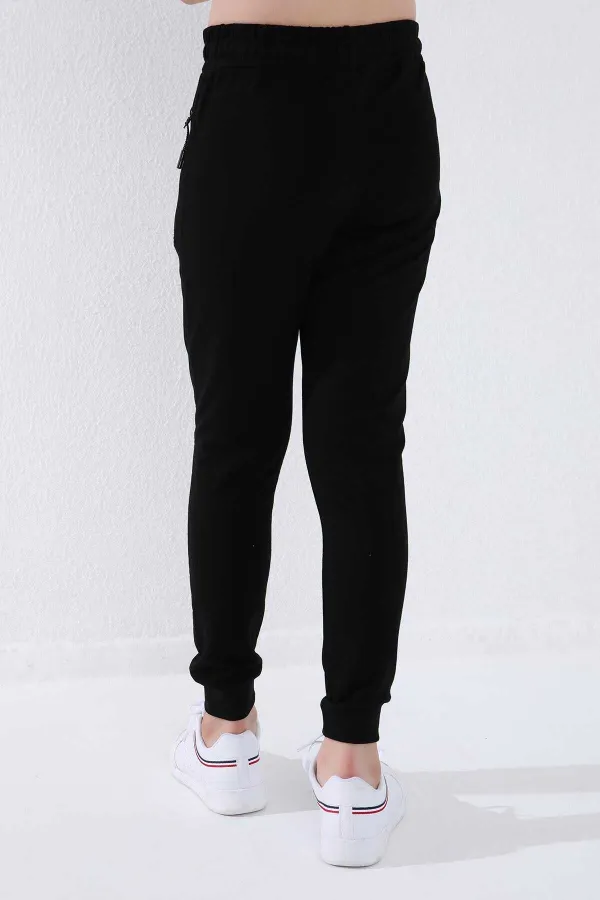 Pantalon de jogging noir pour garçon Tommylife, avec poche zippée, coupe standard et ourlets resserrés - 64042