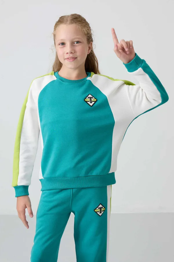 Ensemble de survêtement Tommylife Wholesale pour filles de 7 à 15 ans, col rond, coupe standard, réf. 75165, bleu marine et vert.