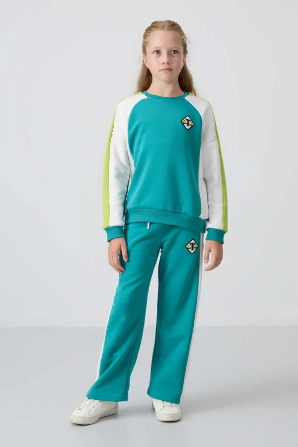 Ensemble de survêtement Tommylife Wholesale pour filles de 7 à 15 ans, col rond, coupe standard, réf. 75165, bleu marine et vert.