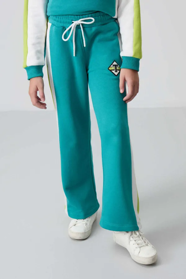 Ensemble de survêtement Tommylife Wholesale pour filles de 7 à 15 ans, col rond, coupe standard, réf. 75165, bleu marine et vert.