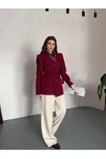 VESTE AVEC CEINTURE D'ÉPAULE ET MANCHES TOMBASES