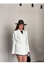 VESTE AVEC CEINTURE D'ÉPAULE ET MANCHES TOMBASES