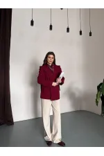 VESTE AVEC CEINTURE D'ÉPAULE ET MANCHES TOMBASES