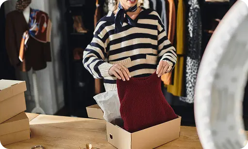 Person packaging a box